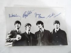 A promo / repro depicting The Beatles be