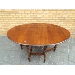 A good quality mahogany gate lag table h