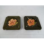 Moorcroft pottery - Two square ashtrays