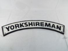 A cast iron wall plaque entitled Yorkshi