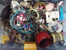 A box of mixed costume jewellery to incl
