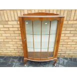 An oak fronted glass display cabinet, approximate height 123 cm x 77 cm x 31 cm.