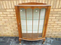An oak fronted glass display cabinet, approximate height 123 cm x 77 cm x 31 cm.