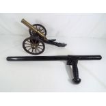 A truncheon / baton marked Monadnock PR-24-S and a good quality model of a gatling gun (2) Est £30