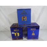 Bells Old Scotch Whisky - three Royal commemorative decanters containing 8 year old extra special