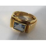 A lady's yellow gold gold ring stamped .750 (indicating 18 carat) set with aquamarine, approx 7.