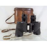 A pair of Bausch & Lomb 6x30 binoculars inscribed CCB733 (marked with crow's foot) and contained in