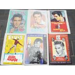 Elvis - Six decorative tin wall signs featuring Elvis Presley. Approximately 43 cm x 31 cm.