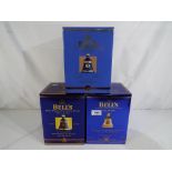 Bells Old Scotch Whisky - three Royal commemorative decanters containing 8 year old extra special