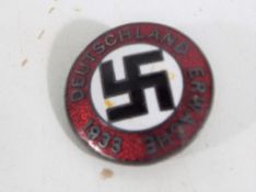 A German enamelled badge marked 1933.