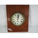 A ship's bulkhead clock, Roman numerals on a white metal dial, with subsidiary seconds dial,