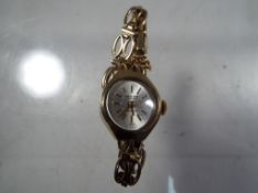 A lady's 9ct gold wristwatch marked Excalibur to the dial total weight all in approx 12.