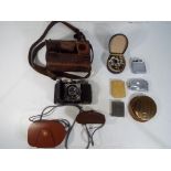 Lot to include a Kodak Retina folding camera in case, two Ronson cigarette lighters,