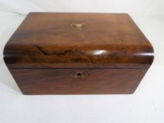A 19th century mahogany writing box, with inlaid mother-of-pearl decoration to the top,