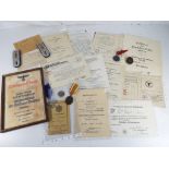 German military - a quantity of German military memorabilia to include medals, cap badges,