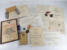 German military - a quantity of German military memorabilia to include medals, cap badges,