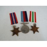 Three World War II (WW2) medals with ribbons, boxed.