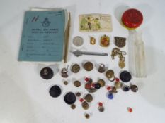 A mixed lot to include a Royal Air Force service and release book, a quantity of vintage buttons,