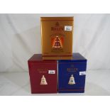 Bells Old Scotch Whisky - three Christmas decanters containing 8 year old extra special Old Scotch