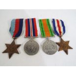 Four World War Two (WW2) military medals.
