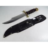 A classic Bowie knife with approx 21 cm blade.