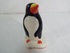 Carltonware - a Carltonware penguin advertising Guinness.