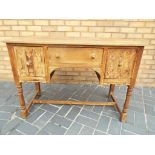 A carved oak dressing table,