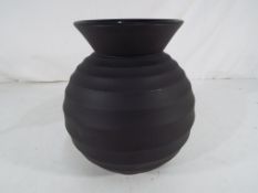 Wedgwood - a Wedgwood black basalt ribbed football vase, marked to the base Nick Munro, Wedgwood,
