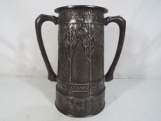 A David Veazey for Liberty & Co Art Nouveau, Tudric pewter twin handled tankard ca.