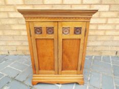 A good twin door hardwood cabinet with inlaid decoration,