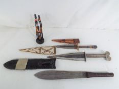 Three tribal knives to include a Maasai example and similar