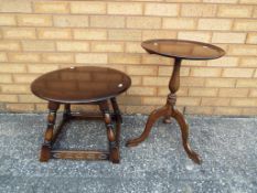 A mahogany tripod table and a dark oak round occasional table [2]