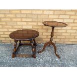 A mahogany tripod table and a dark oak round occasional table [2]