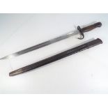 A bayonet with leather scabbard, inscribed to the blade with broad arrow / crow's foot, U X E,