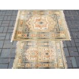 A matching pair of carpets/rugs to include rug and runner,