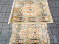 A matching pair of carpets/rugs to include rug and runner,
