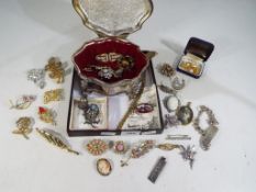 A good mixed lot to include a plated jewellery box containing twenty five,