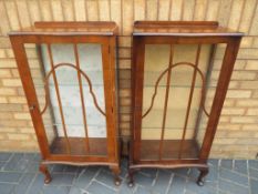 A matching pair of glass fronted display cabinets approximate height 150 cm x 56 cm x 30 cm.