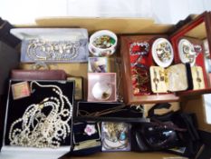 A large box containing a quantity of predominantly vintage costume jewellery,