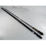 A antique ebonised sword stick with brass lion pommel,