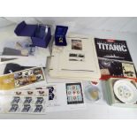 A good mixed lot to include RMS Titanic related commemorative coins and stamps,