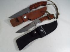 Two camping/hunting knives.