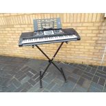 Yamaha AXP 25 electronic keyboard on stand with leads and other accessories