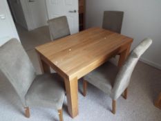 Oak Furniture land - a kitchen table and four chairs,