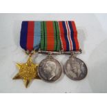 A set of World War One (WW1) trio miniature medals.