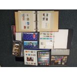 Philately - Two albums containing a quantity of UK stamps, an album containing first day covers,