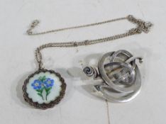 A silver guillache enamelled floral locket set with marcasite and chain and a vintage Ola Gorie