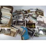 In excess of 400 early - mid period UK and foreign postcards together with an album of postcards