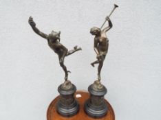 A pair of French patinated bronze sculptures depicting Fortuna and Mercury,