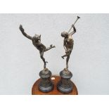 A pair of French patinated bronze sculptures depicting Fortuna and Mercury,